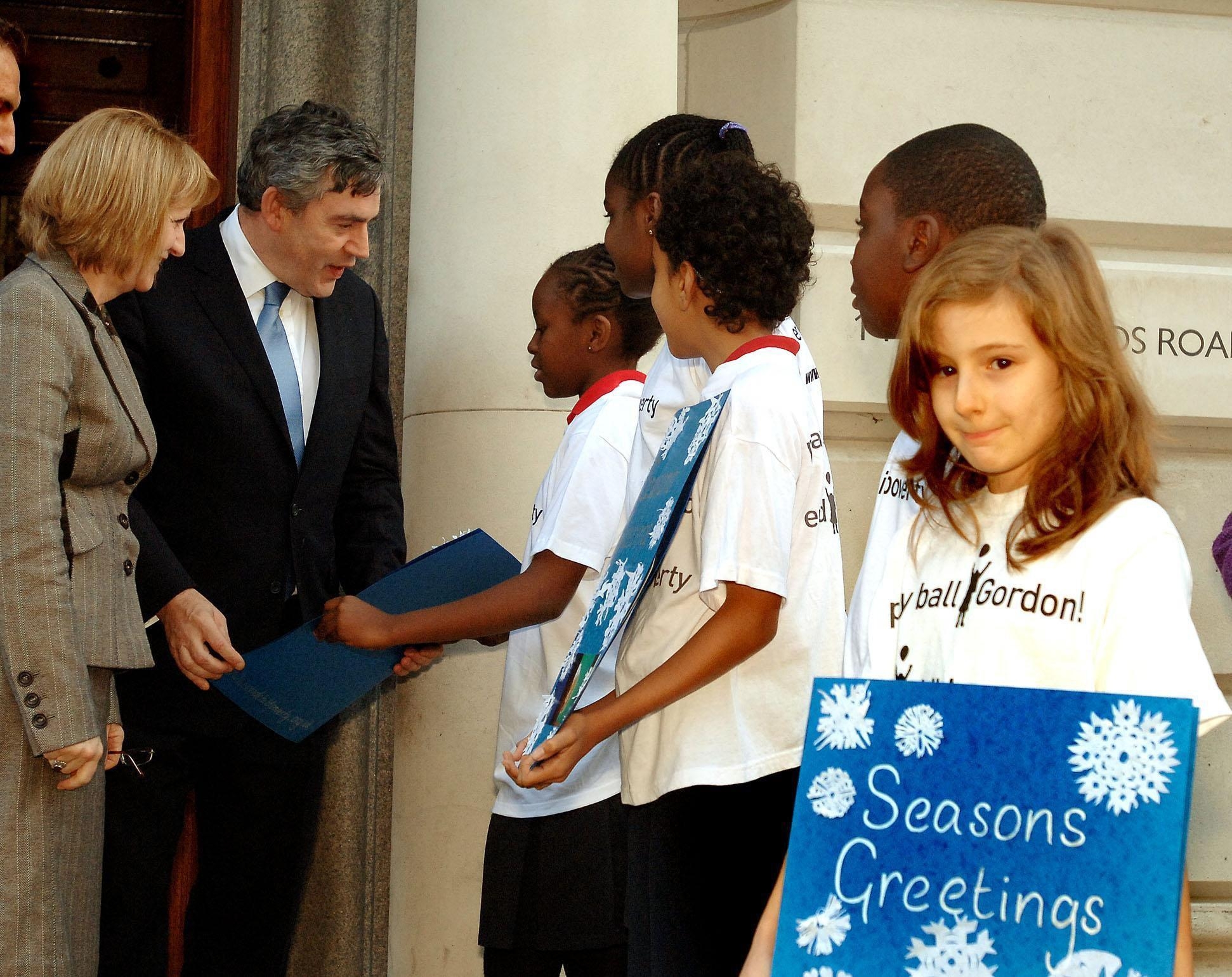 Bev and Gordon Brown talking to young people about the End Child Poverty Campaign